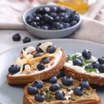 Toast made with peanut butter and blueberries