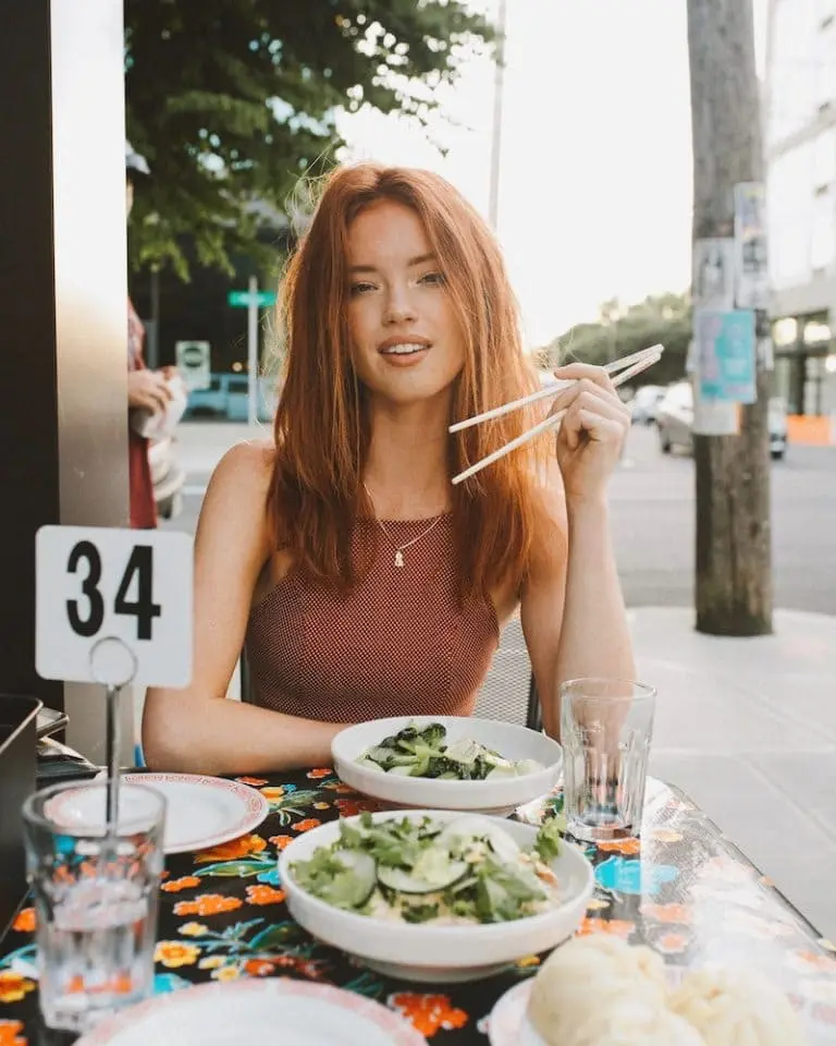 A woman eating street food